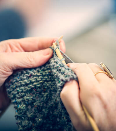 Close up hands knitting