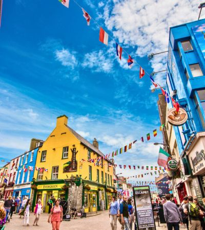 Colourful street with shops and bunting
