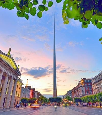 Wide street in Dublin with GPO and spire